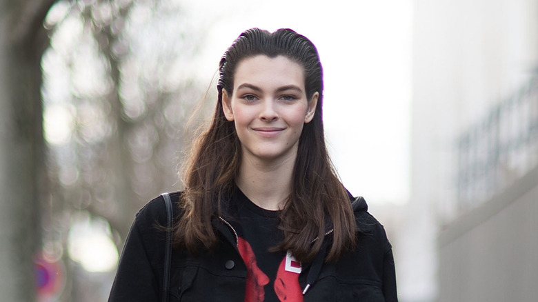 Vittoria Ceretti smiling during Paris Fashion Week in 2016