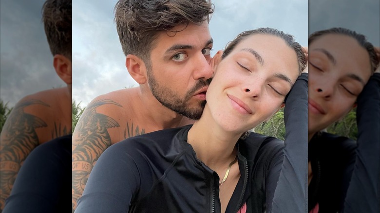 Matteo Milleri kissing Vittoria Ceretti's neck