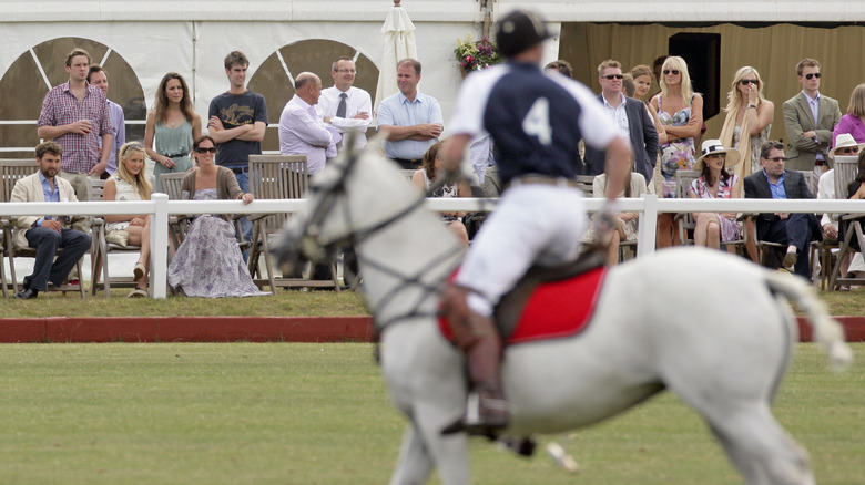 Kate Middleton watching Prince William play polo