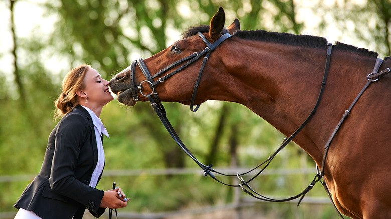Woman nose to nose with horse