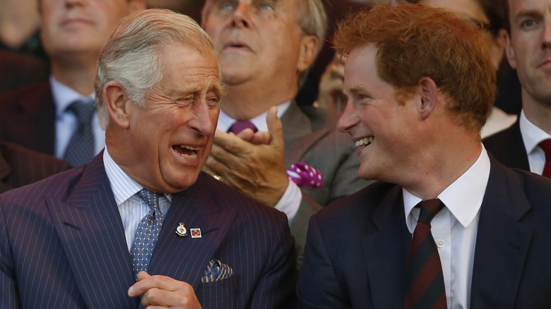 Prince Harry and Prince Charles smiling