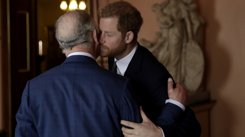 Prince Harry kissing King Charles on the cheek