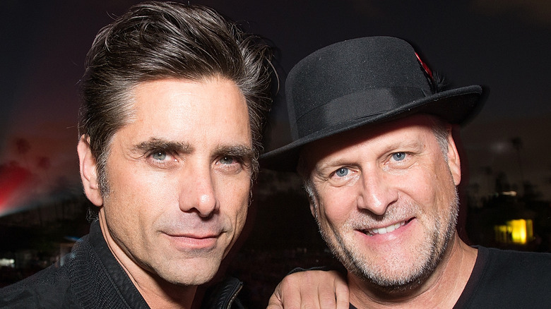 John Stamos and Dave Coulier pose together at an event