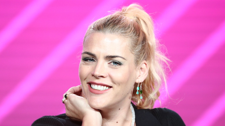 Busy Philipps smiles at an event