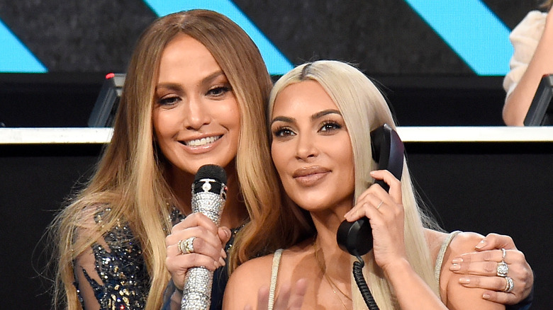 Jennifer Lopez and Kim Kardashian pose at an event together