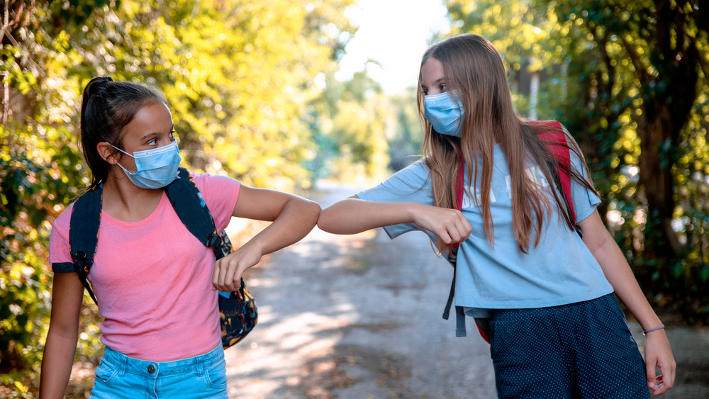 Bumping elbows instead of shaking hands