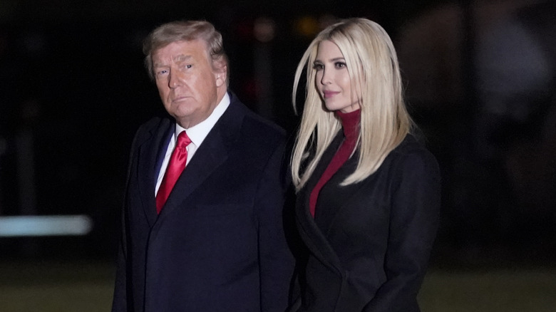 Donald and Ivanka Trump walking in black coats