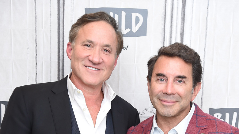 Terry Dubrow and Paul Nassif pose and smile