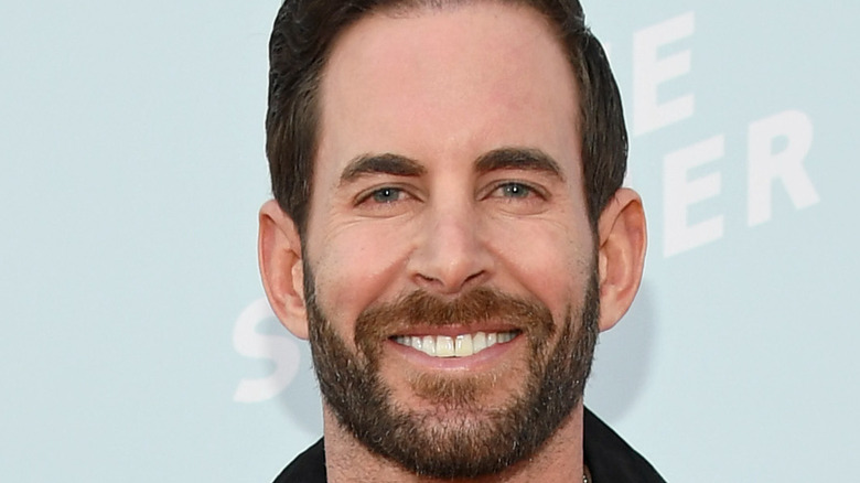 Tarek El Moussa smiles on the red carpet