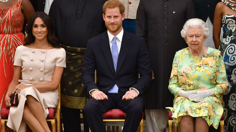 Meghan Markle, Prince Harry, Queen Elizabeth sitting 2018