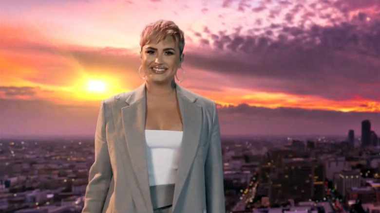 Demi Lovato in front of sunset