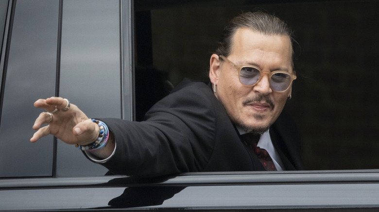 Johnny Depp waving from car