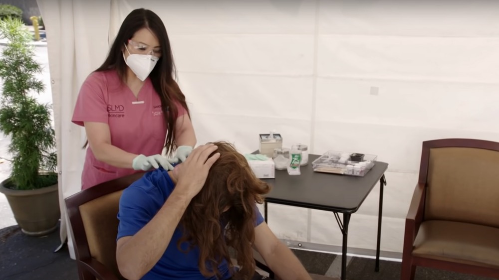 Dr. Pimple Popper with a patient