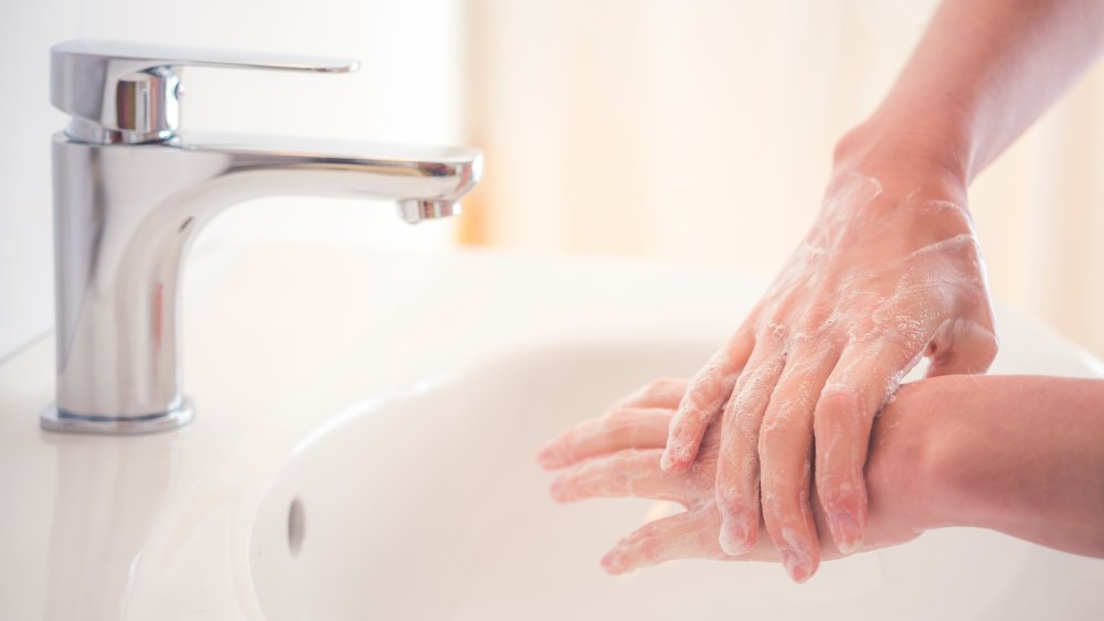 Woman washing her hands