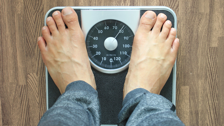 Person's feet on weighing scale