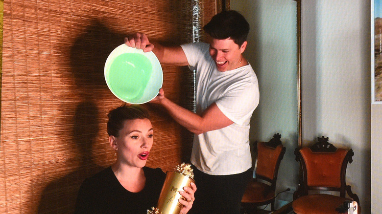 Colin Jost pouring slime on Scarlett Johansson at MTV 2021 Awards