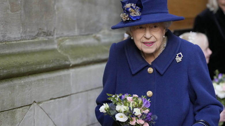 Queen Elizabeth using a cane