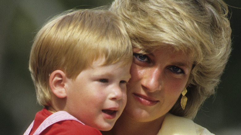 Princess Diana holding Prince Harry