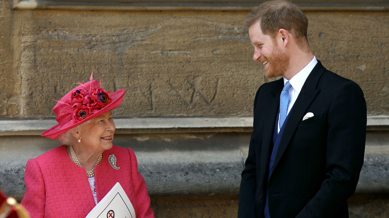 Queen Elizabeth and Prince Harry smiling