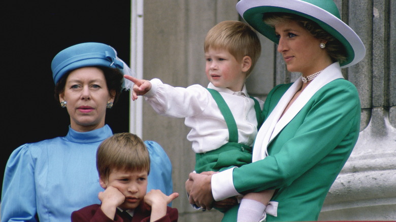 Princess Margaret stands behind Prince William, next to Princess Diana holding Prince Harry