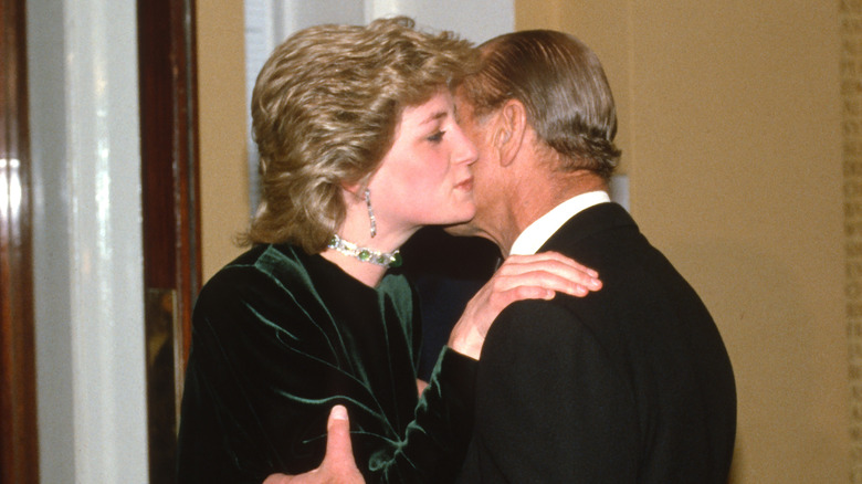 Prince Philip embracing Princess Diana