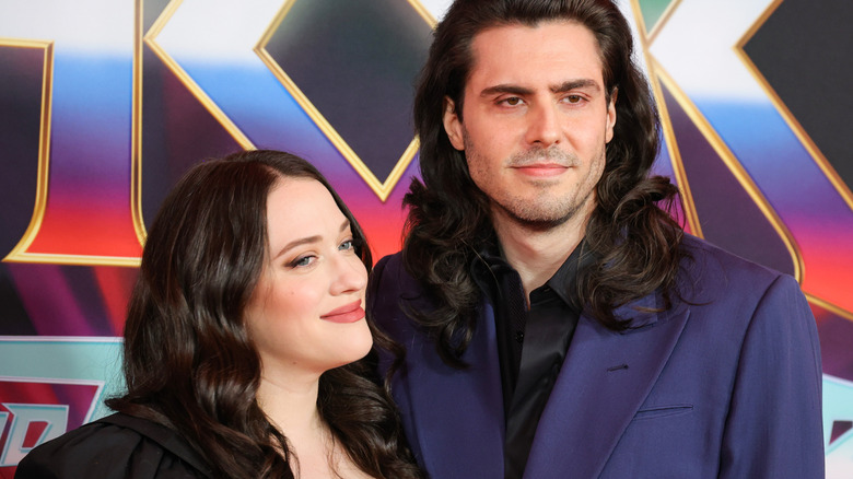 Kat Dennings and Andrew W.K. smirking on the red carpet