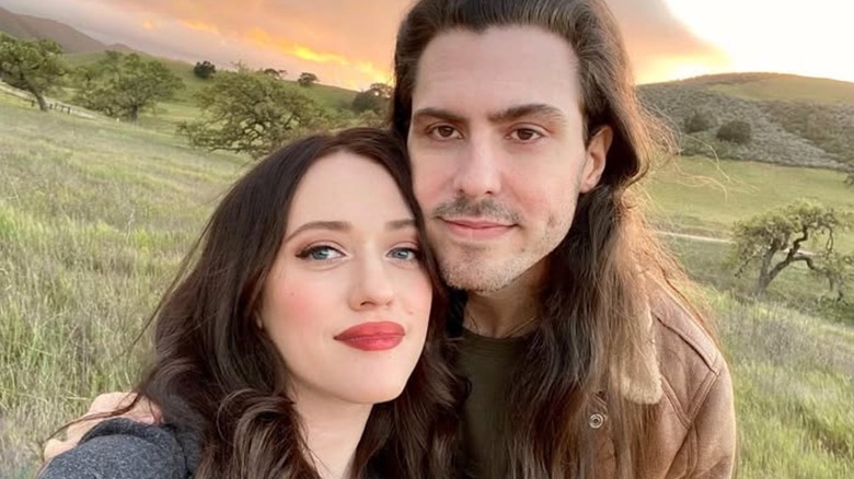 Kat Dennings and Andrew W.K. smiling in a selfie at sunset