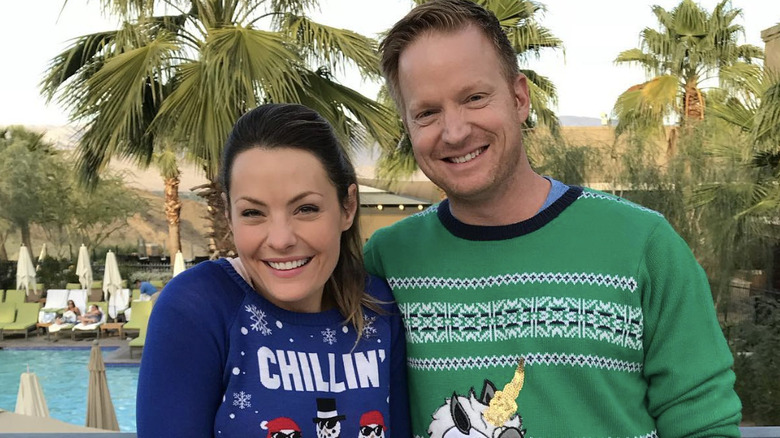 Eric & Lindsey Bennett wearing Christmas sweaters