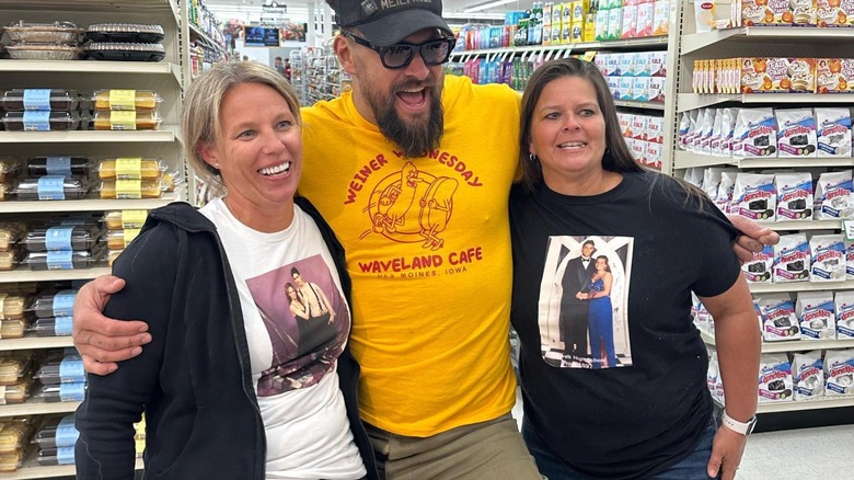 Jason Momoa and two women smiling