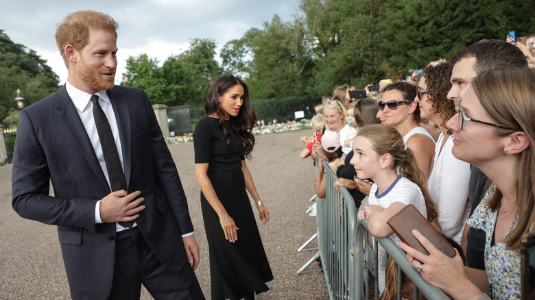 Prince Harry and Meghan Markle meeting mourners at Windsor Castle