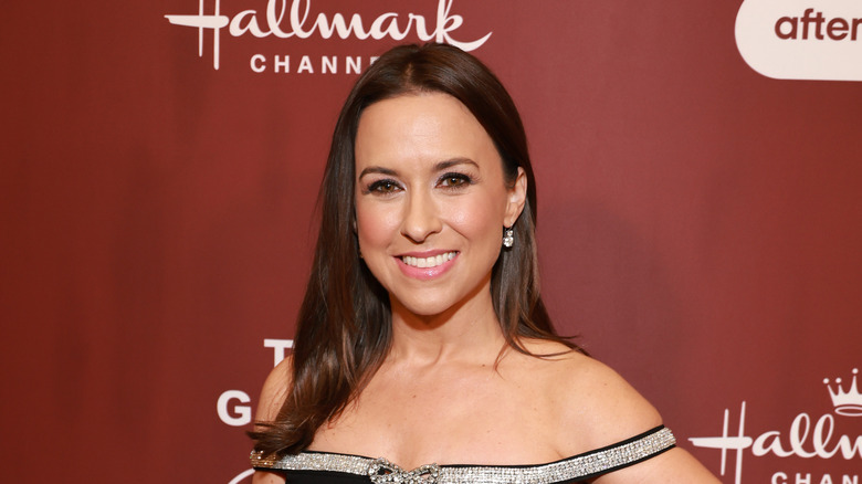 Lacey Chabert with red backdrop