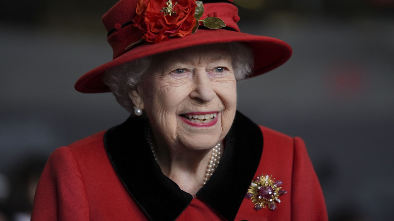 Queen Elizabeth red outfit brooch