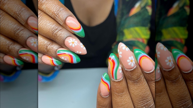 Hands showing swirl and flower nail design