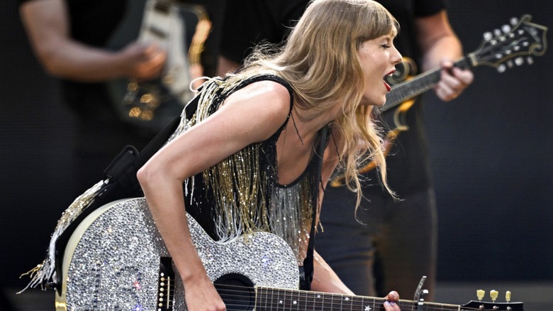 Taylor Swift playing guitar