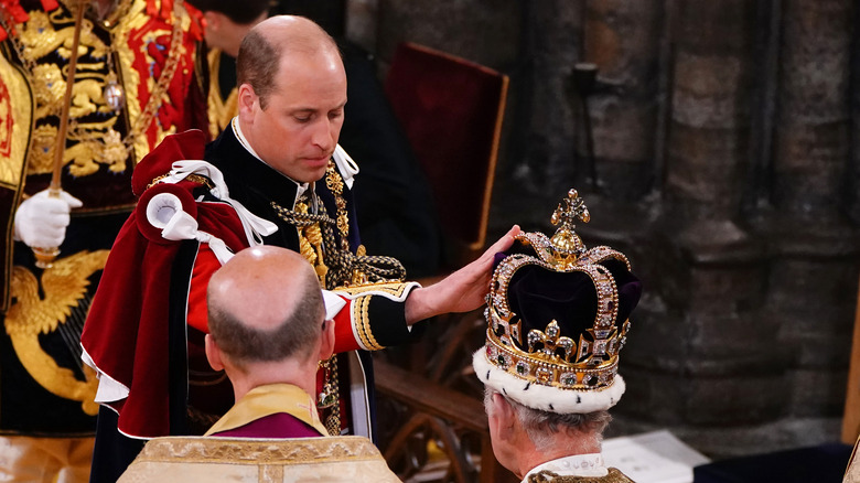 Prince William touches Charles' crown