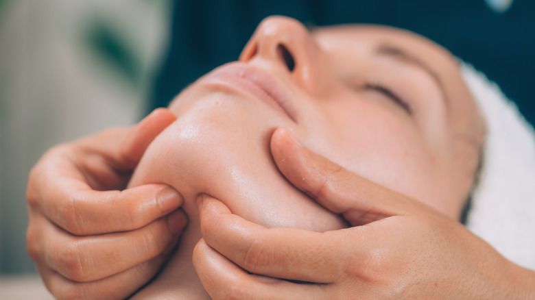 Person getting a facial massage