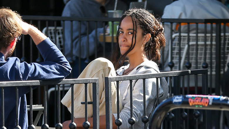 Malia Obama sitting