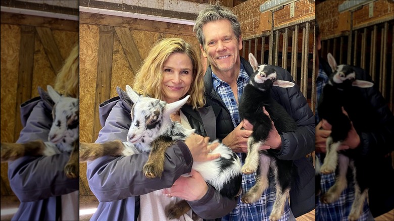 Kyra Sedgwick and Kevin Bacon holding baby goats