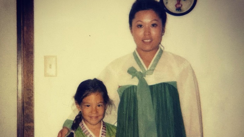 Young Joanna posing with her mother 