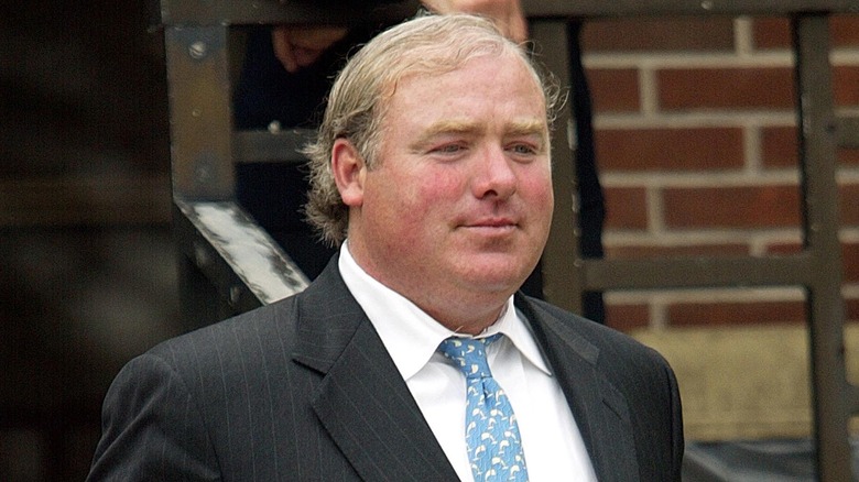 Michael Skakel walking with a blank expression