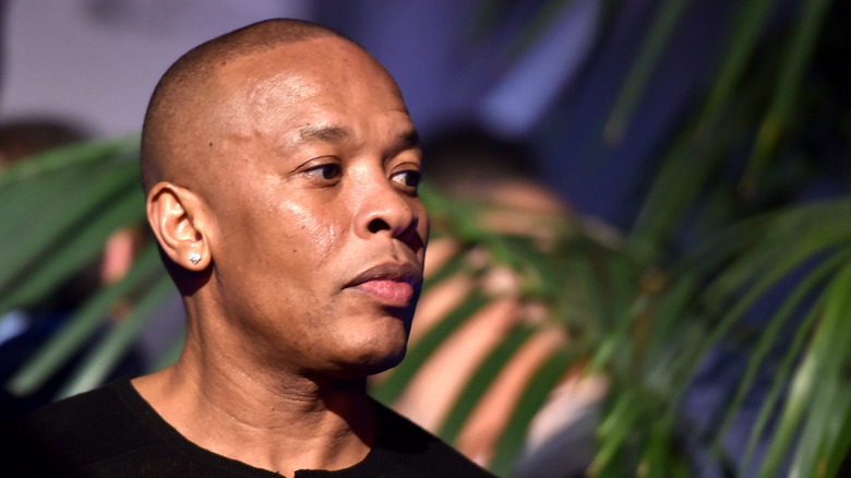 Dr. Dre looks pensive at an event