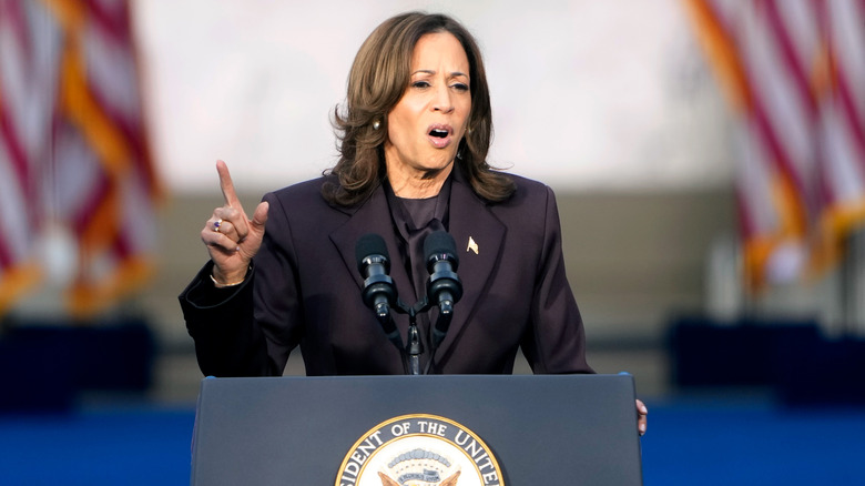 Kamala Harris pointing on stage during her concession speech