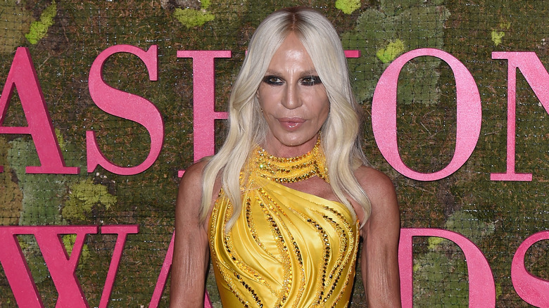 Donatella Versace posing at the Green Carpet fashion awards