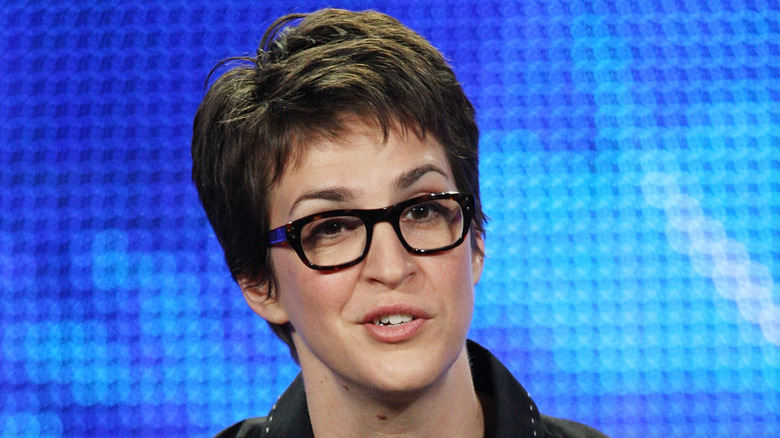 Rachel Maddow wearing glasses at 2009 press event