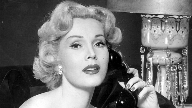 Zsa Zsa Gabor holding phone receiver