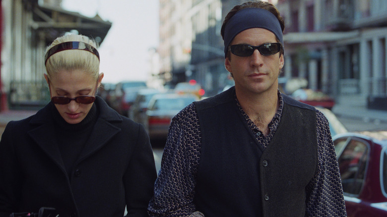 Carolyn Bessette Kennedy and John F. Kennedy Jr. walking outside