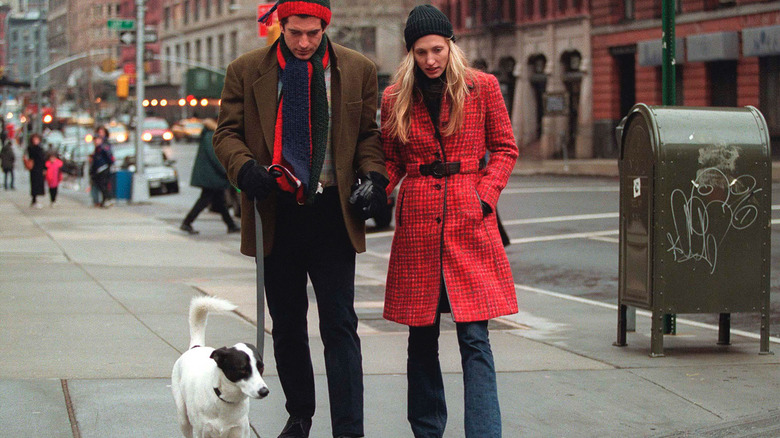 Carolyn Bessette Kennedy and John F. Kennedy Jr. walking their dog