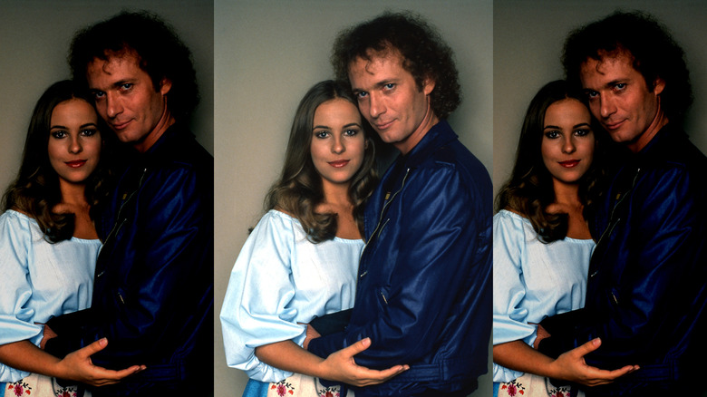 Luke and Laura embracing