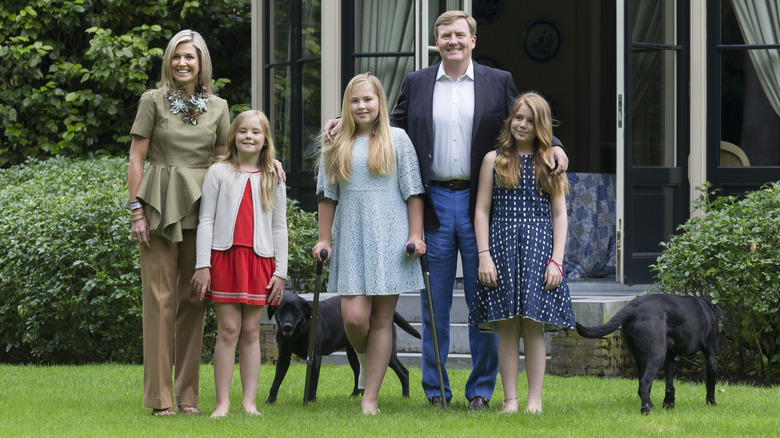 Dutch royal family posing outside house