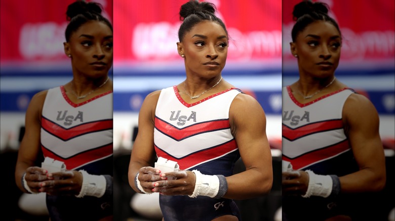 Simone Biles looking on 